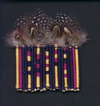 guinea fowl feathers and thread-wrapped sticks